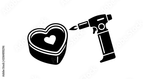 Heart shaped chocolate candy being torched by a butane torch, close-up
