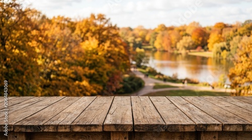 Wooden Table Overlooking Autumn River Landscape Scene.