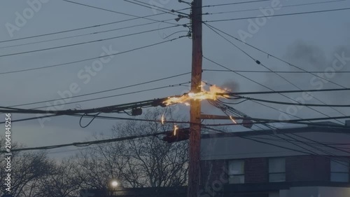 Burning Electrical Wires on Utility Pole with Flames and Smoke
