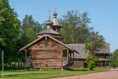 Chapel from the village Kashira of Malaya Vishera district in the Vitoslavlitsi open-air Museum of Folk Wooden Architecture on a sunny summer day, Veliky Novgorod, Russia