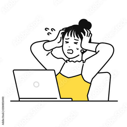 pcを見てパニックになるまとめ髪の若い女性