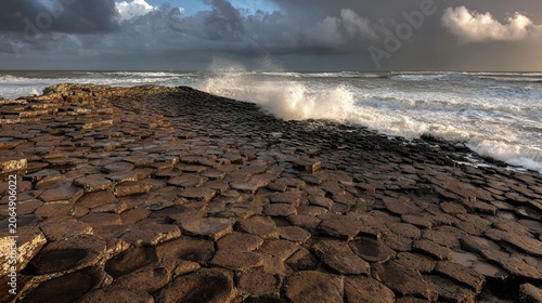 basalt. Hexagonal stone columns on a coast with waves and a dramatic sky. inspiring travel planning, ESG reports, designed for environmental awareness campaigns, used by store managers.