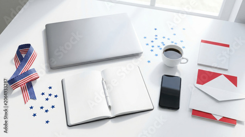 patriotic office workspace with laptop and notepad