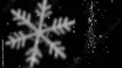 Falling white snowflakes on a solid black background
