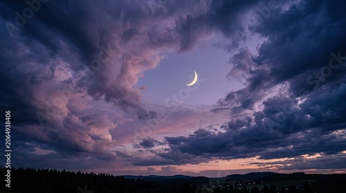 Dramatic twilight landscape with a crescent moon peeking through stormy purple and pink clouds over a silhouetted forest