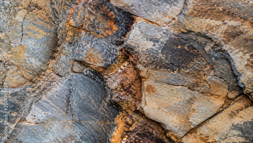 Abstract Natural Rock Texture with Cracked Stone Surface and Earthy Mineral Patterns