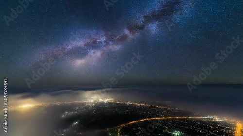 Milky Way Galaxy and City Lights Above the Fog 4K Generative AI