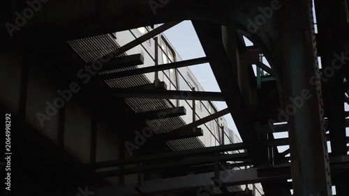 Indoor staircase with metal railings in a dark building