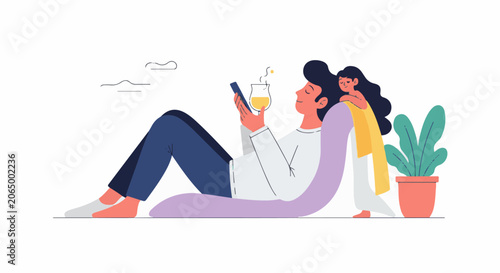 A man and woman relaxing together on the floor with a plant