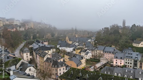 Grand Duchy of Luxembourg time lapse city skyline and fog haze at Grund along Alzette river in the historical old town