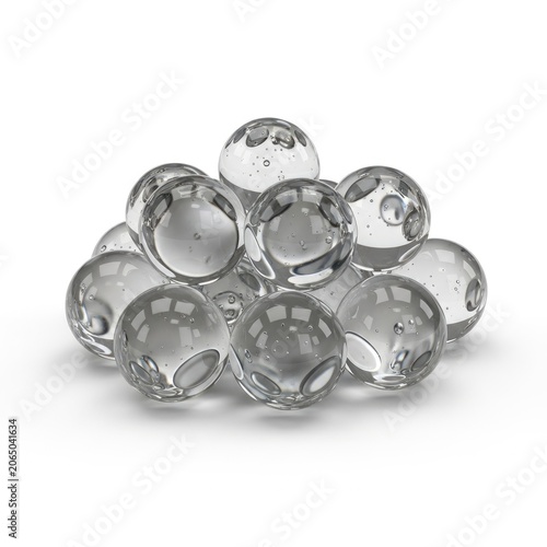 Clear Glass Marbles Stacked on White Background.