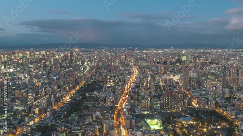 Osaka Japan time lapse city skyline day to night at city center