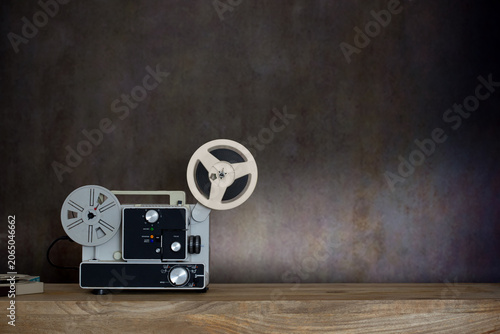Vintage Super 8 Film Projector on Wooden Table with Copy Space