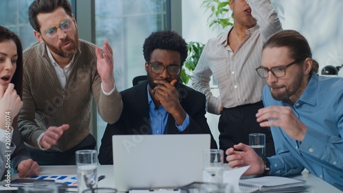 Photography Multiracial business team partners managers looking in laptop losing upset with online failure work problem at office meeting