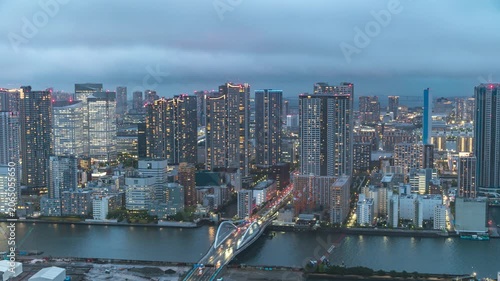 Tokyo Japan time lapse city skyline day to night cityscape at Odaiba river and Tsukiji Ohashi Bridge