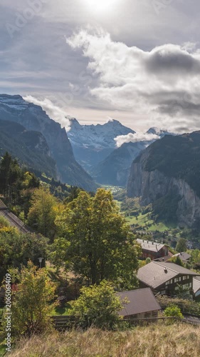 Wengen Switzerland time lapse nature landscape at village and Jungfrau peak in autumn season (vertical)