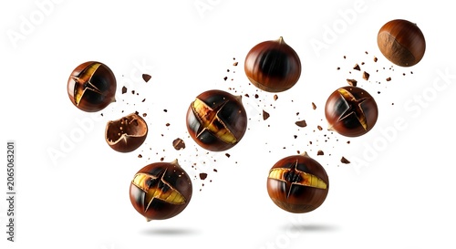 Roasted chestnuts flying and falling isolated on white background. Group of delicious marroni nuts with cracked shells for autumn and winter seasonal food concept.