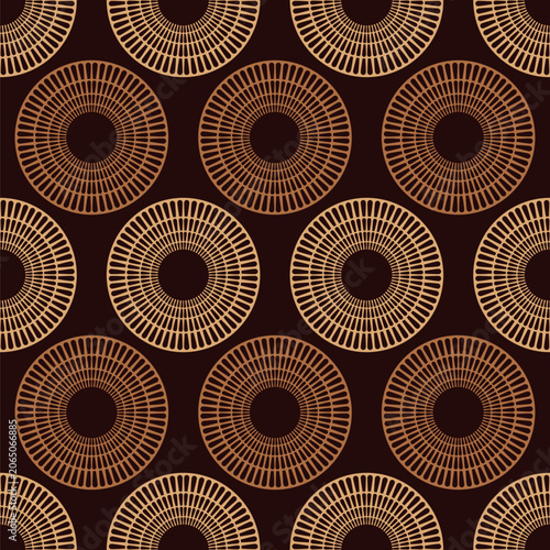 Seamless vector geometric pattern with stylized bronze suns or circles isolated on a dark brown background. Abstract ethnic boho circle design. Color endless vector background. Geometric shapes.