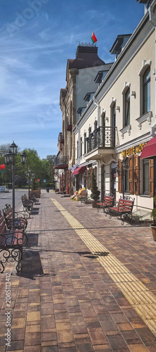 Street view of charming buildings and benches in town