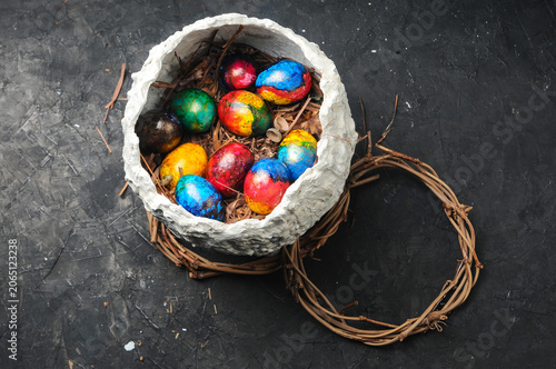 Easter Eggs in Nest on Dark Background