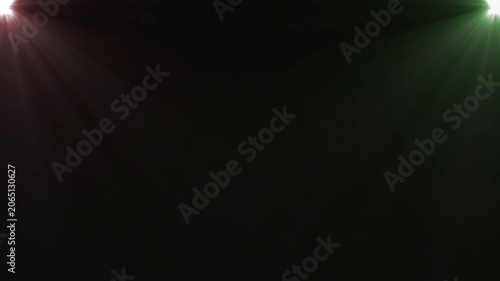 Red and Green Stage Spotlights Beam Motion on Black Background