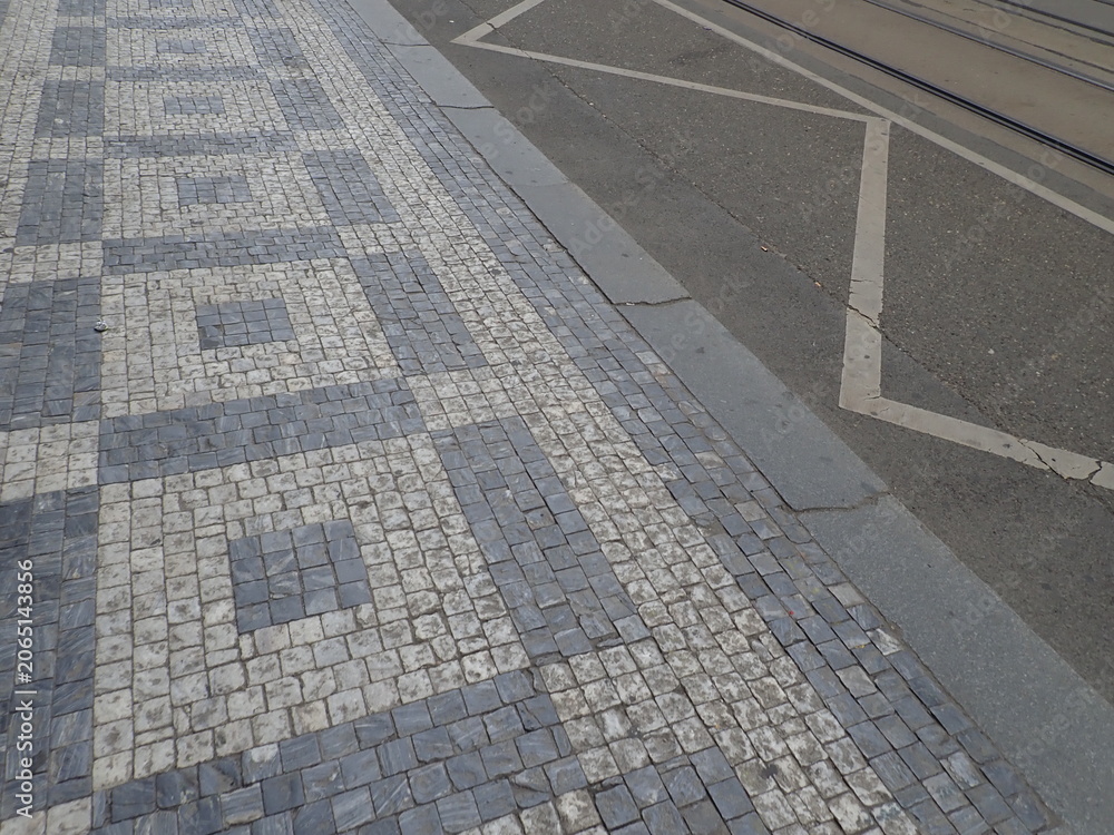Fototapeta premium cobble tiles pattern on a street in city