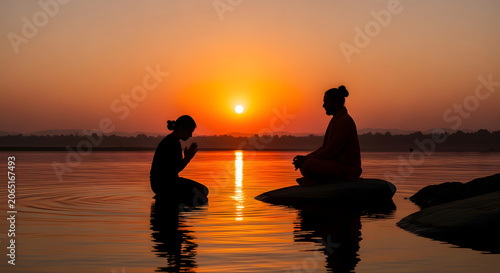 Guru purnima celebration with student bowing to teacher at sunrise