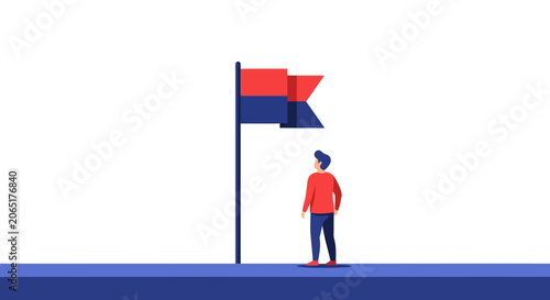 Person Standing Beside Tall Colorful Signal Flag Outdoors.