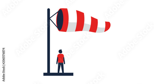 Person standing beside colorful windsock illustration.