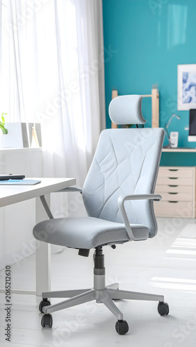 Creative design studio with a light gray ergonomic office chair featuring a soft lumbar cushion, set in an airy modern workspace. 