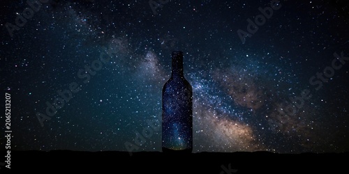 Isolated bottle featuring a luminous night sky with Milky Way stars inside