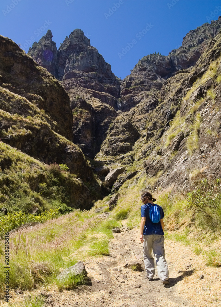 Fototapeta premium Views along the scenic hiking trail ascending from San Pedro,descending from the high threshing ground Era de Berbique toward the coastal village of Puerto de las Nieves in northwest Gran Canaria, Can