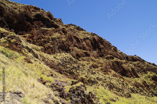 Views along the scenic hiking trail ascending from San Pedro,descending from the high threshing ground Era de Berbique toward the coastal village of Puerto de las Nieves in northwest Gran Canaria, Can