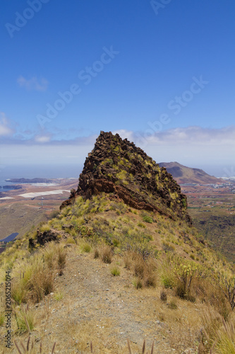 Views along the scenic hiking trail ascending from San Pedro,descending from the high threshing ground Era de Berbique toward the coastal village of Puerto de las Nieves in northwest Gran Canaria, Can