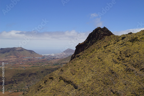 Views along the scenic hiking trail ascending from San Pedro,descending from the high threshing ground Era de Berbique toward the coastal village of Puerto de las Nieves in northwest Gran Canaria, Can