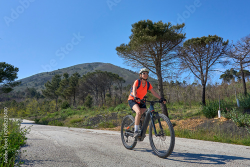 Active senior woman riding ...