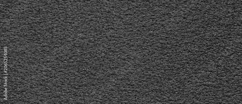 Schilderij op canvas Ultrawide dark foam texture with rough porous surface, subtle grain, natural imperfections, and industrial material pattern