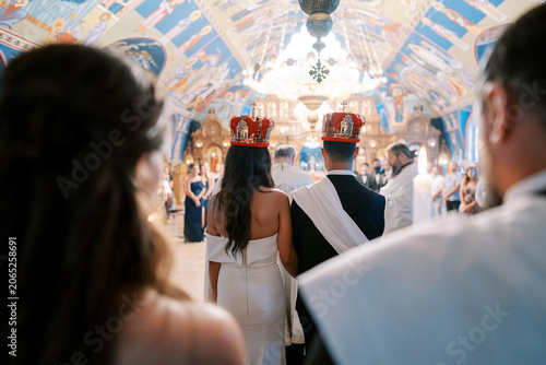 Cuadro en lienzo Traditional Orthodox wedding ceremony with crowns in ornate church