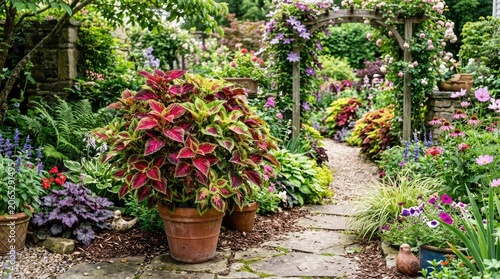 A lush garden with a variety of flowers and plants, including potted plants and a stone path leading through the garden.