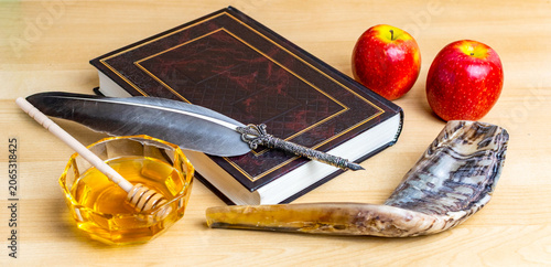 Rosh hashanah symbols with shofar, apples, honey, and sacred book