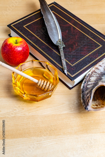 Rosh hashanah symbols with book, shofar, honey and apple