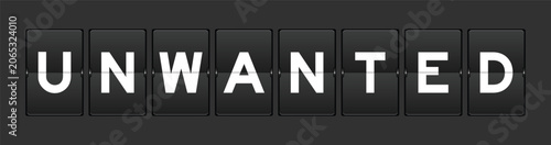 Fotografie Black color analog flip board with word unwanted on gray background
