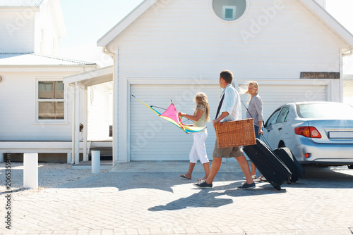 Photos Smile, travel and family outdoor with luggage, road trip and adventure at holiday house
