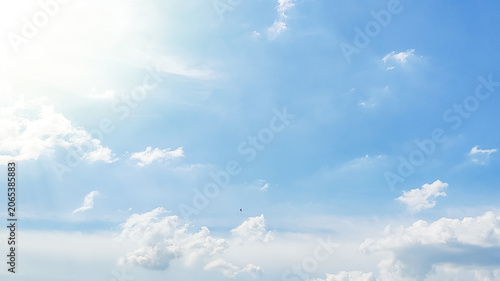 Bright blue sky background filled with soft, white cumulus clouds during daytime. Perfect for nature backdrop, weather concepts, spiritual themes, and outdoor freedom projects