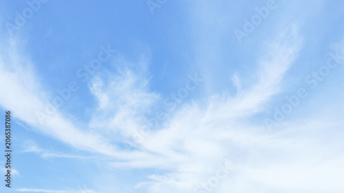 Bright blue sky background filled with soft, white cumulus clouds during daytime. Perfect for nature backdrop, weather concepts, spiritual themes, and outdoor freedom projects