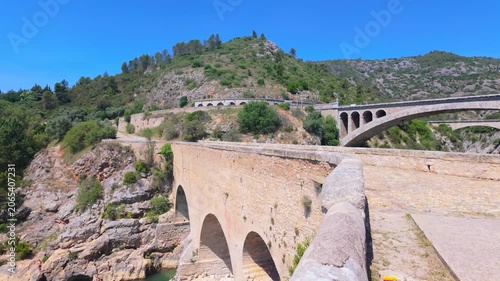 Pont du Diable Bridge Spanning Verdant Gorge in Occitanie, France