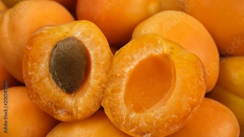 Heap of fresh juice apricot close up, rotation