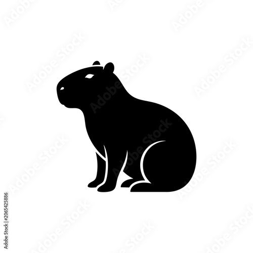 Photos A black silhouette of a capybara sitting peacefully in a natural environment