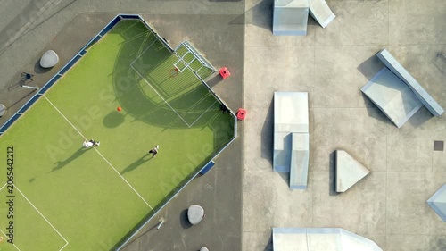 Aerial Drone View of Urban Skate Park and Artificial Turf Sports Court in City Recreation Area