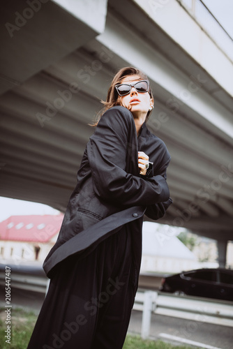 Fashion street portrait of a modern emotional woman